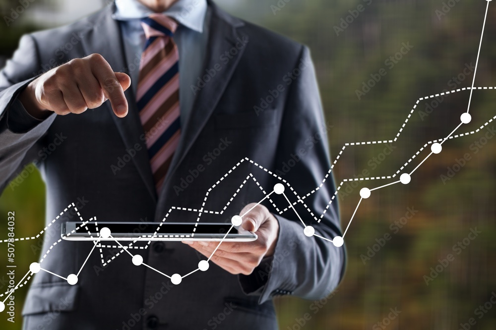 Business mans hand raising amount of CO2 emissions graph concept