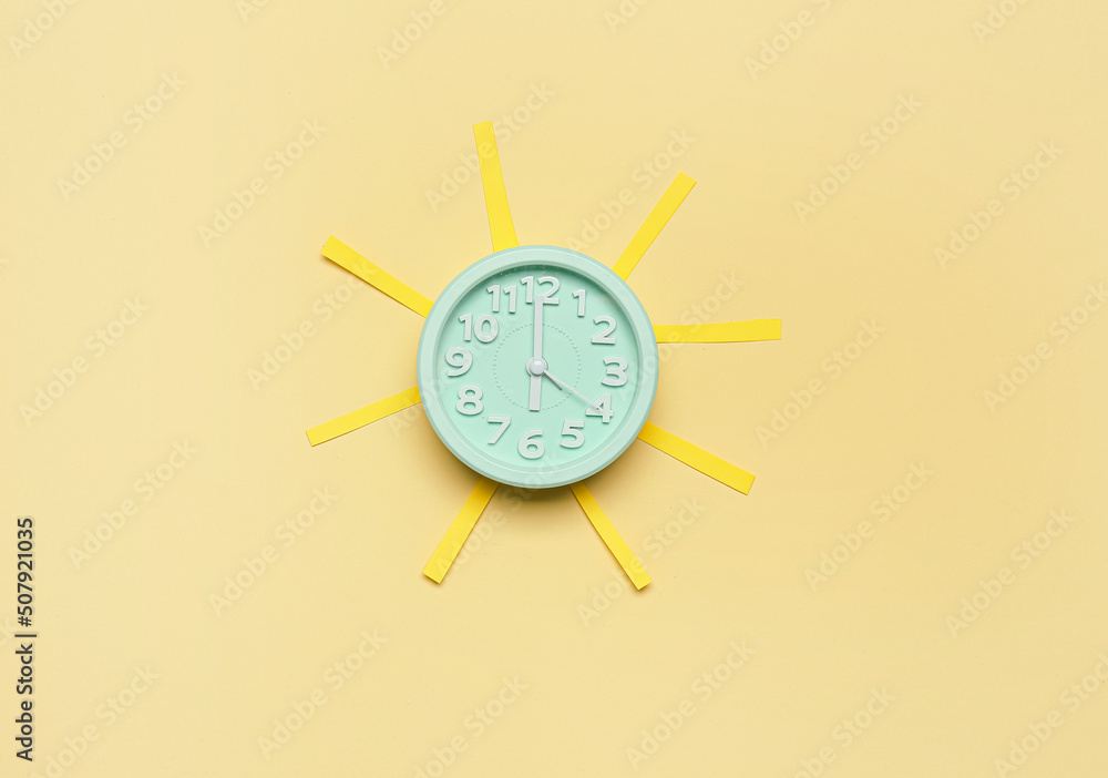 Beautiful composition with alarm clock on color background