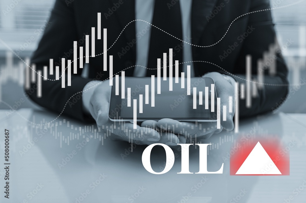 Hand working on digital table. Oil price stock exchange trading up.