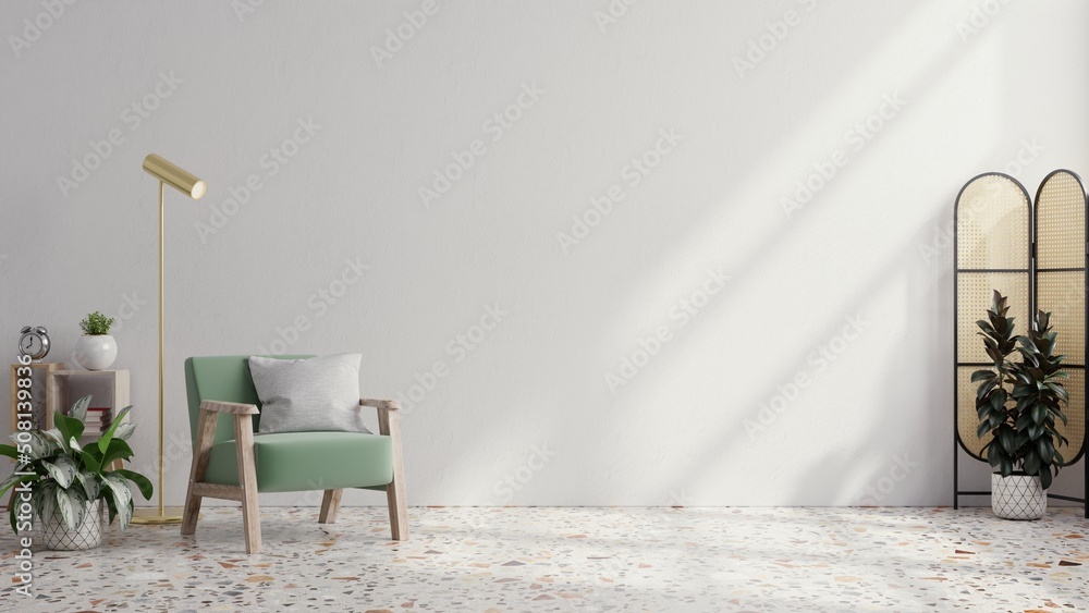 Living room wall mockup with green velvet armchair on blank white interior background.