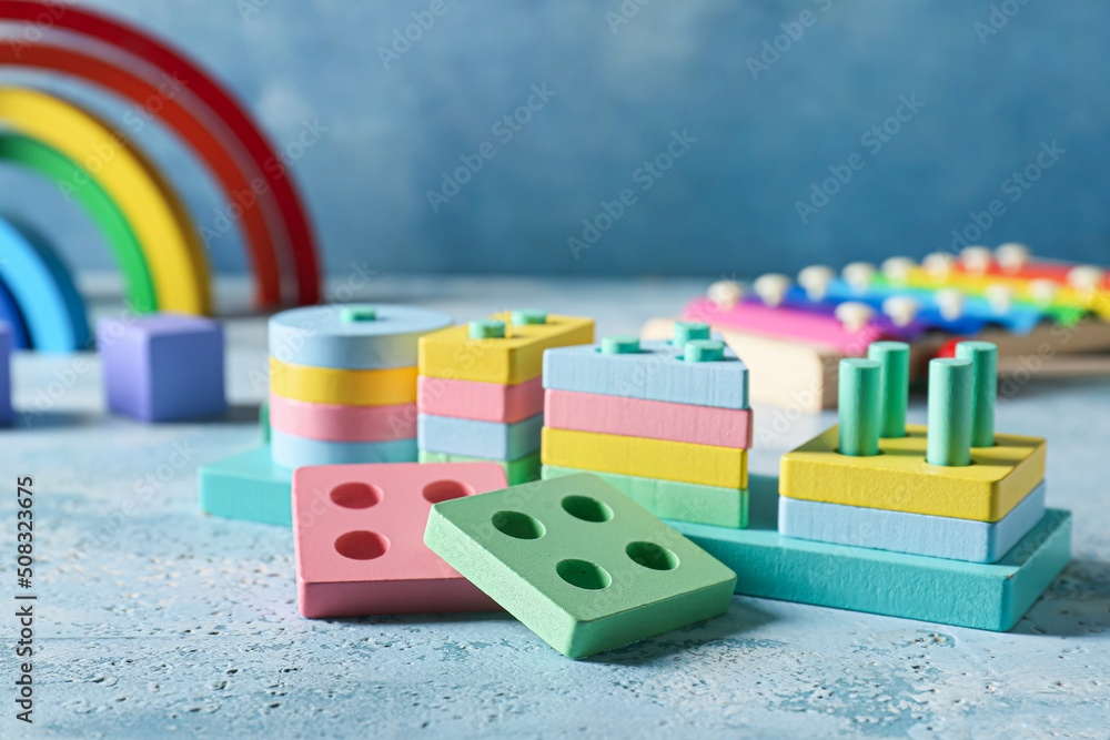 Children building blocks on blue background