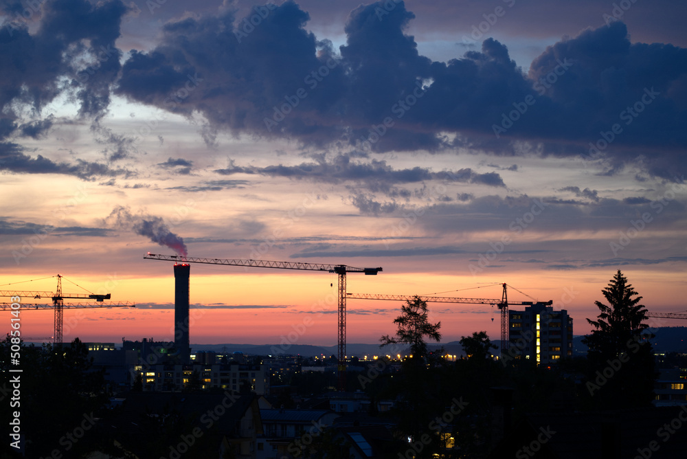 Dramatic night sky at City of Zürich with industrial skyline on a cloudy spring day. Photo taken May