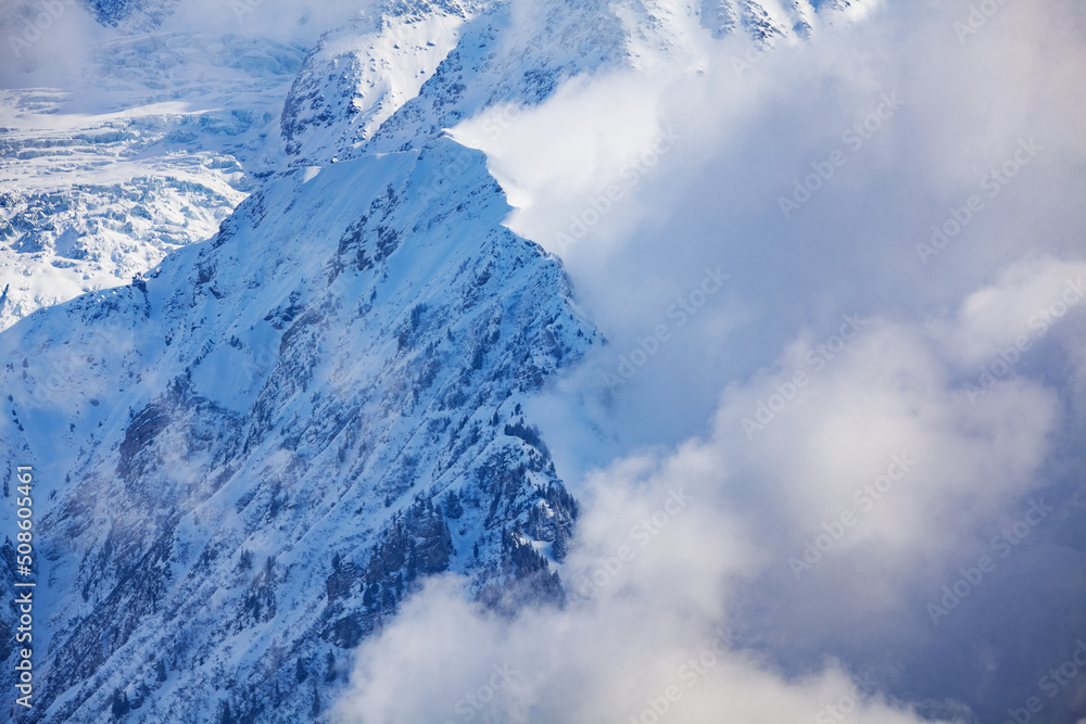 Mont Blanc massive mountains with clouds on one side, top view