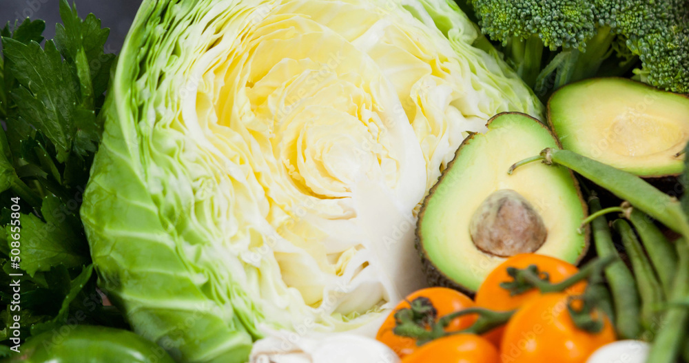 Image of fresh organic vegan food with green and orange vegetables