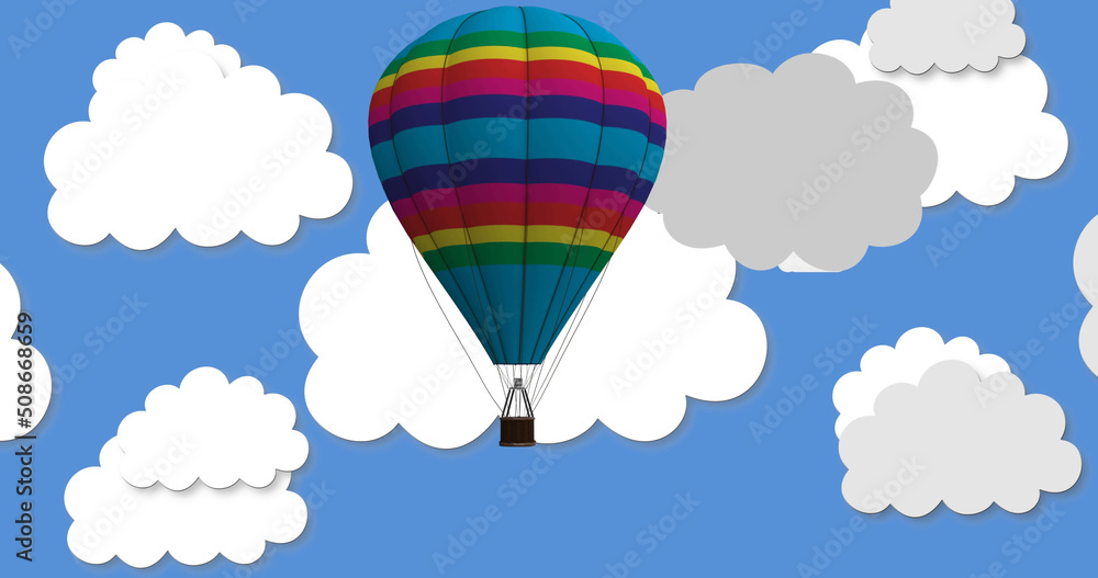 Image of flying balloon with basket over clouds on blue background