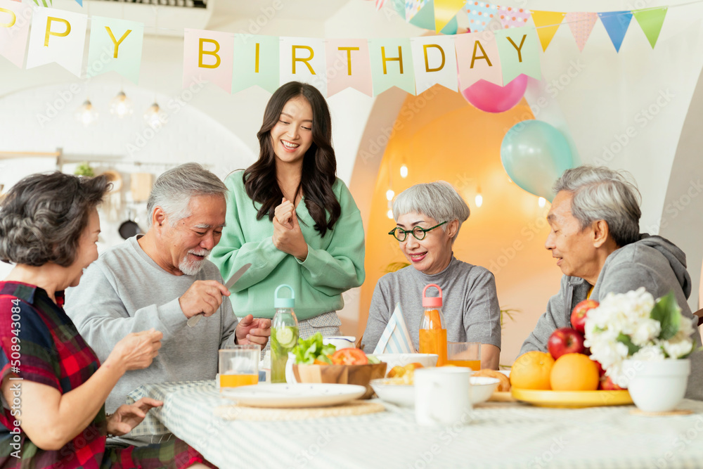 birthday party at senior daycare,group of asian female elder male female laugh smile positive conver