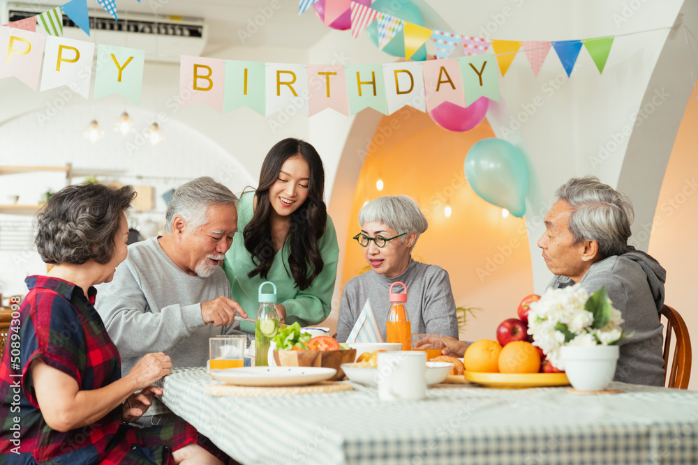 birthday party at senior daycare,group of asian female elder male female laugh smile positive conver