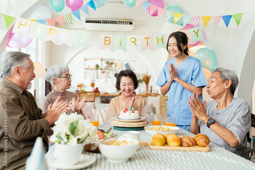 birthday party at senior daycare,group of asian female elder male female laugh smile positive conver