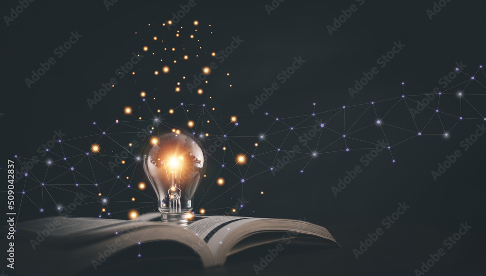 Glowing light bulb on a book, Inspiring from read concept, Educational knowledge and business educat