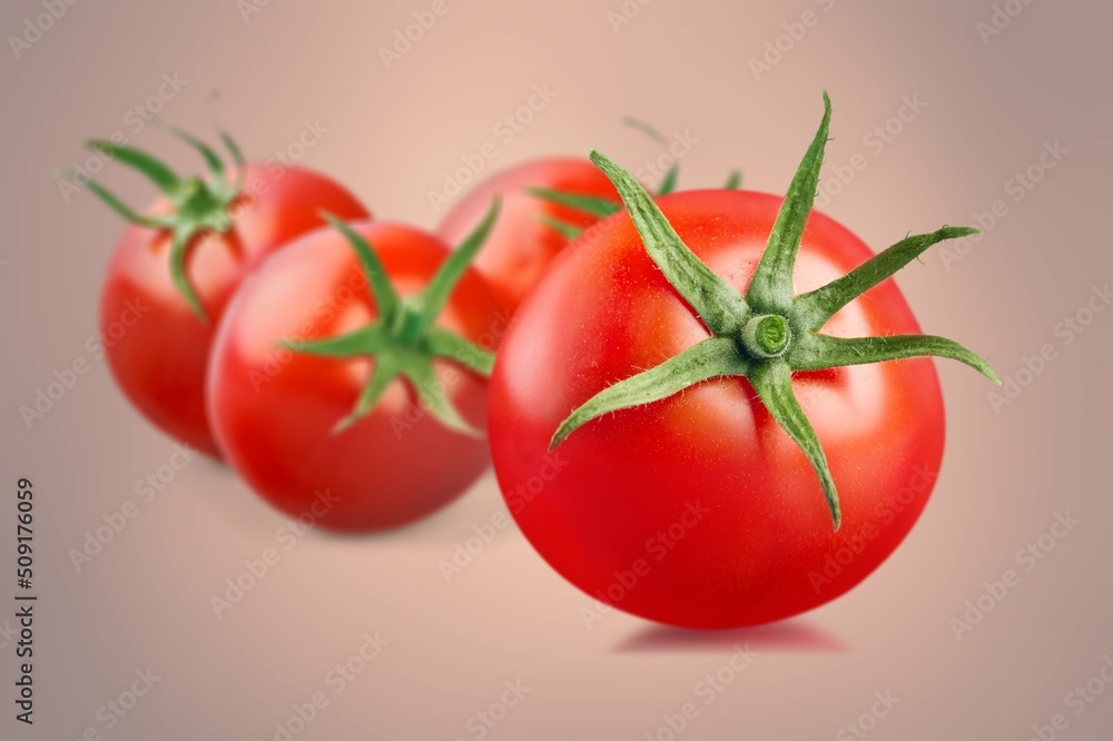 Tasty fresh tomatoes on color background