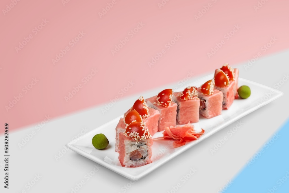 Popular sushi rol with salmon and cream cheese. Sushi menu concept. Modern japanesse food.