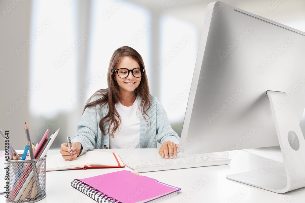 Junior high school students studying at home with books