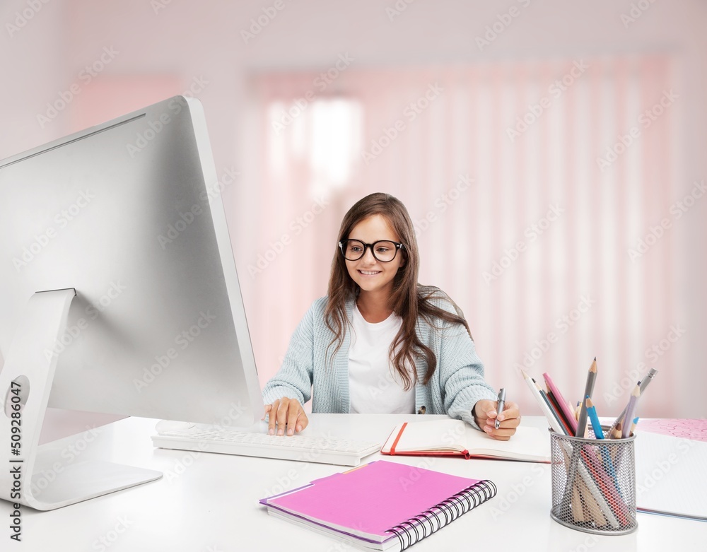 Junior high school students studying at home with books