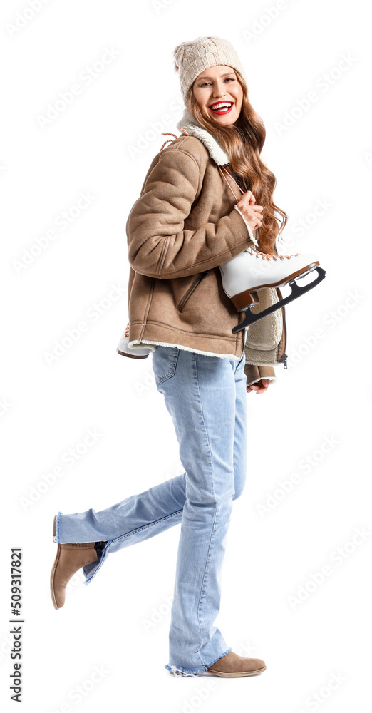 Beautiful young woman with ice skates isolated on white