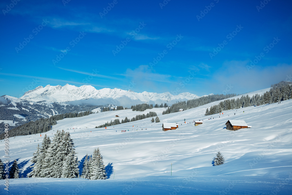 Covered by snow houses after strong snowfall in French Alps