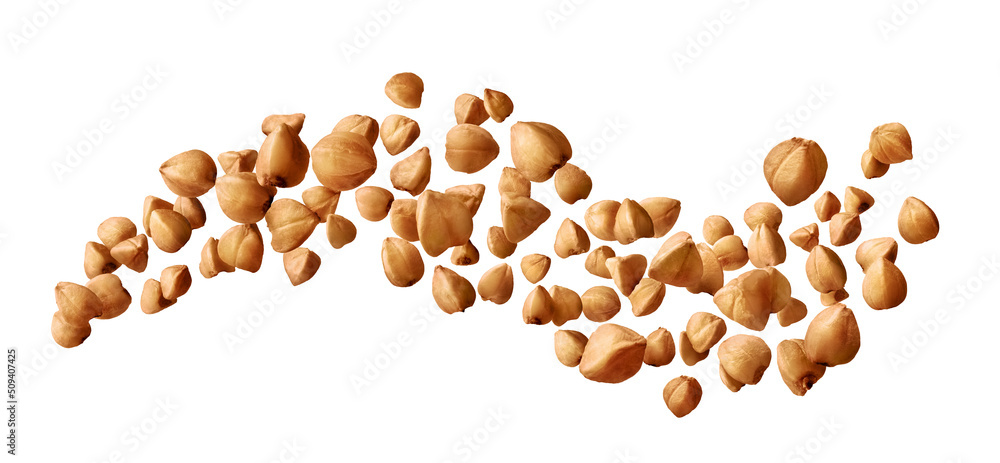 Buckwheat groats flying isolated on white background