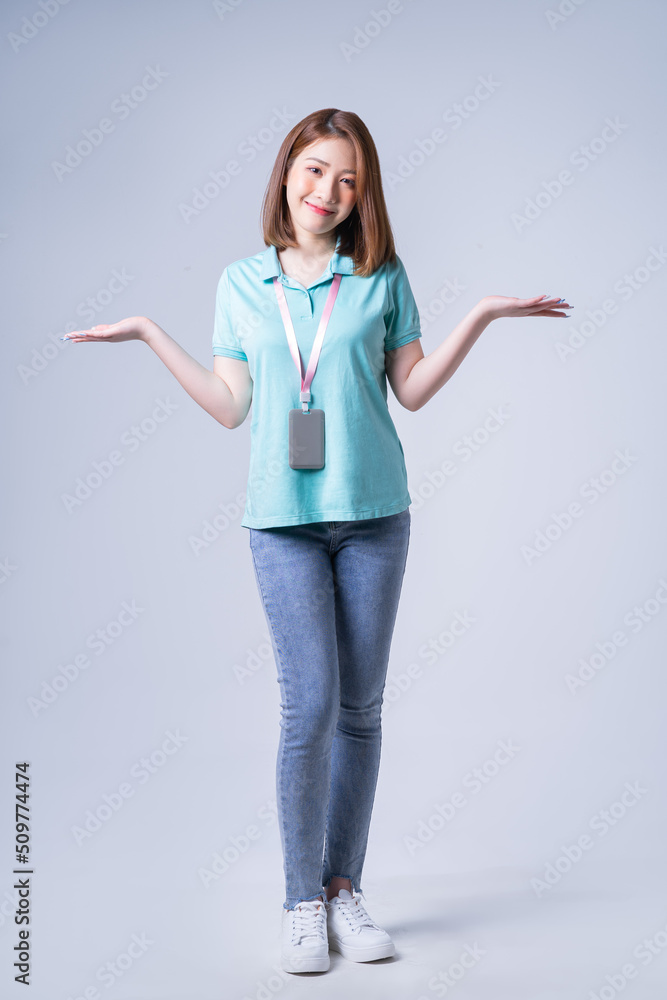 Portrait of young Asian businesswoman on white background