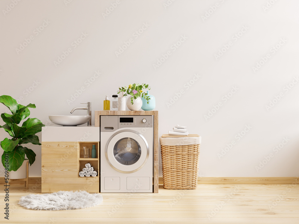 Laundry room with modern washing machine and hygienic wash basin on white wall background.