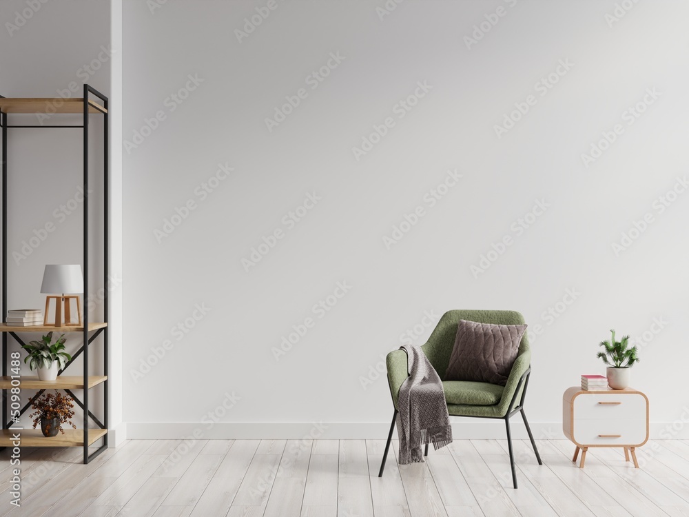 Living room with green armchair and shelf on white wall background.