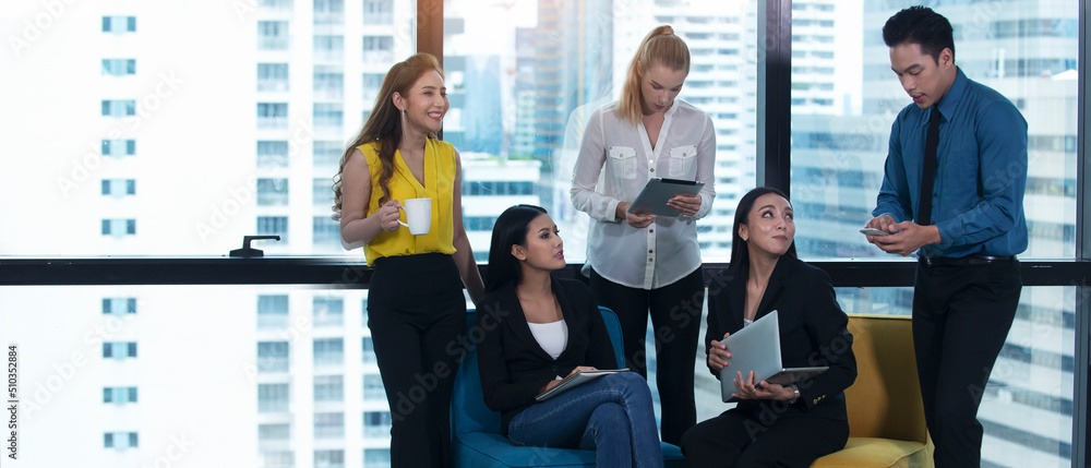 Group of attractive young asian business people team relax  talking  during break time at office