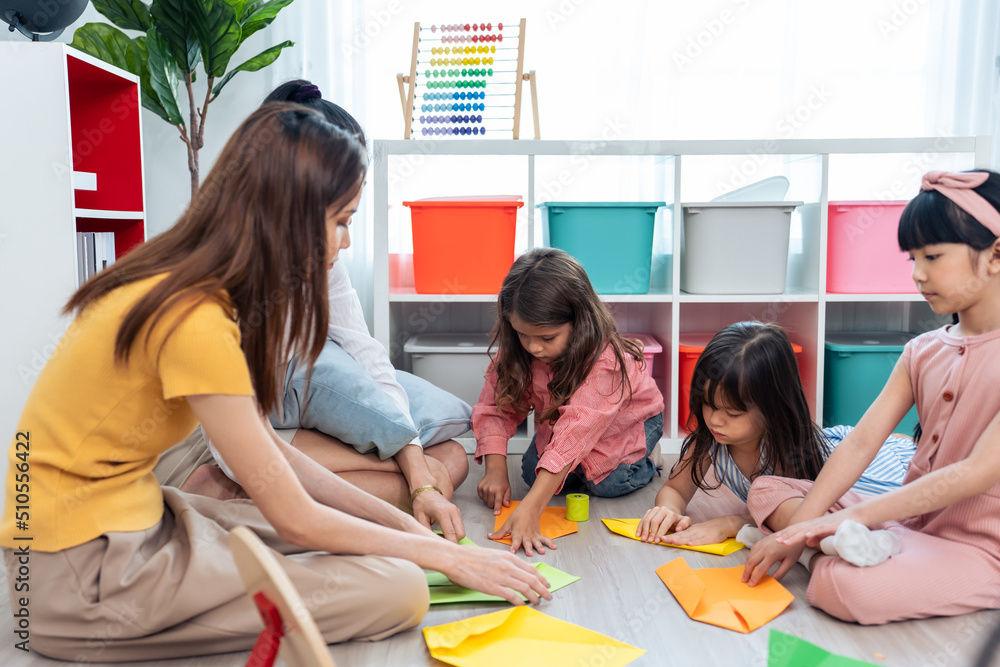 Asian beautiful young woman teacher teaching a lesson to kid at school. 