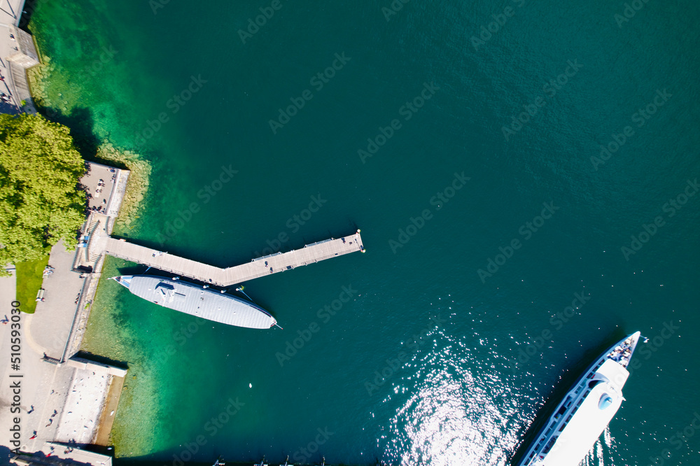 Aerial view of Lake Zürich with pier and passenger ships at City of Zürich on a sunny spring day. Ph