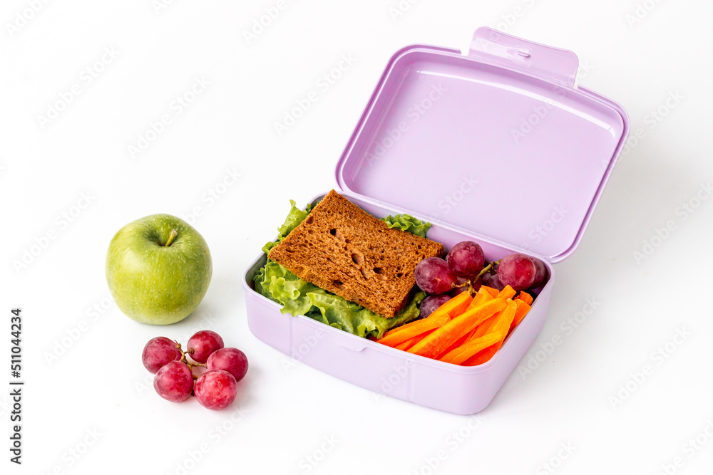 Healthy food in school lunch box. Meal with sandwich and fruits