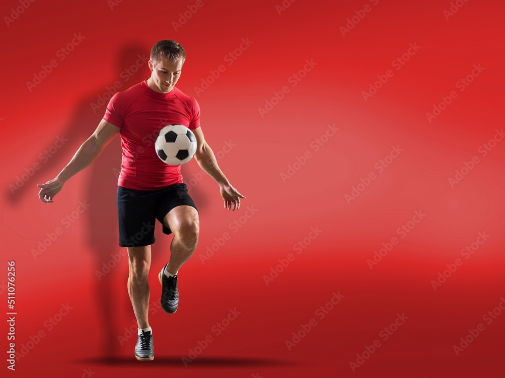 Happy young man football fan cheer up support favorite team juggling soccer ball