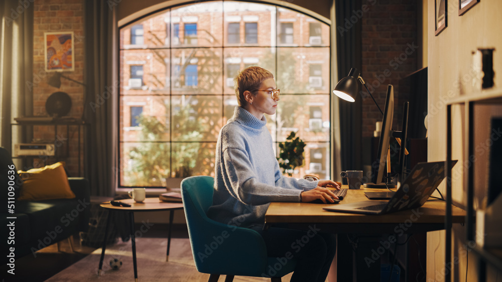 Young Attractive Woman Working from Home on Desktop Computer in Sunny Stylish Loft Apartment. Creati