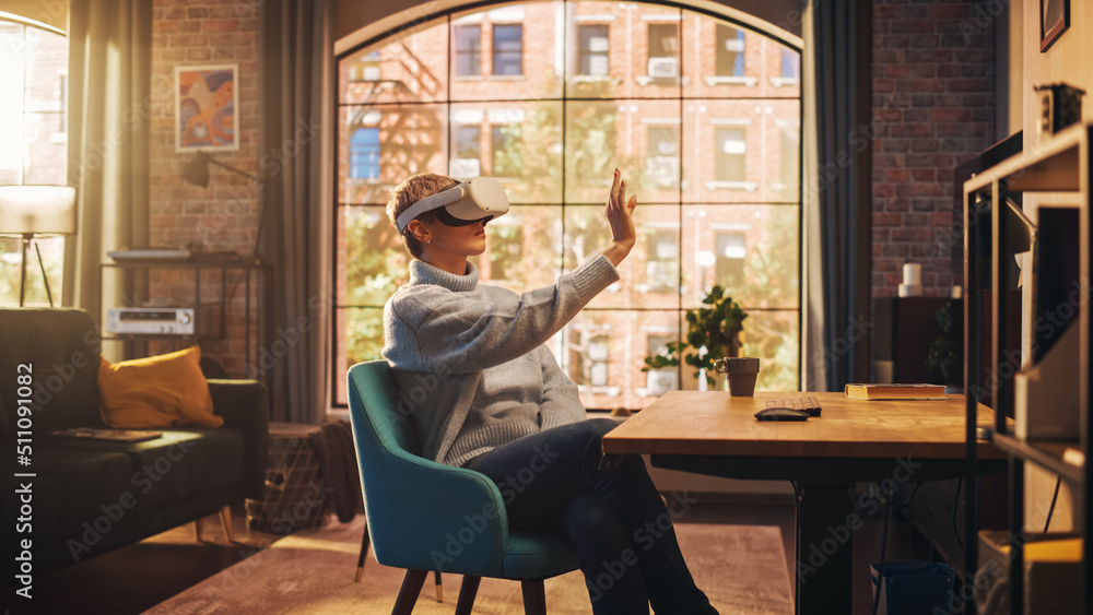 Young Female Gamer with Short Hair Having Fun and Playing Virtual Reality Game at Home in Her Living