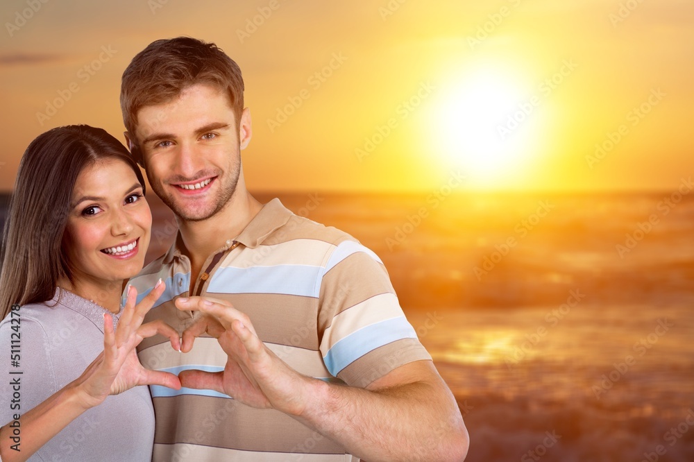 Young cheerful happy couple to joyful, over sea beach ocean outdoor seaside in summer day