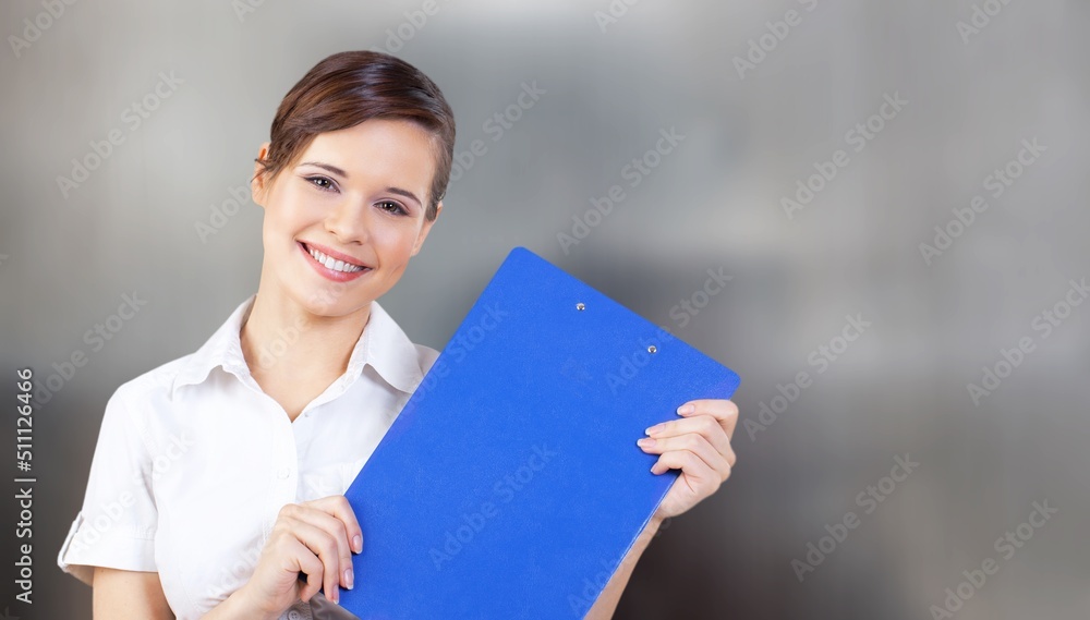 Portrait of smiling young woman waitress. Successful small business owner standing