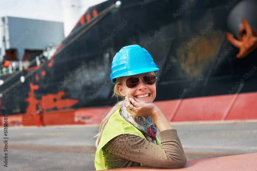 My attitude is never to be satisfied. A confident young woman resting her chin on her hands next to 