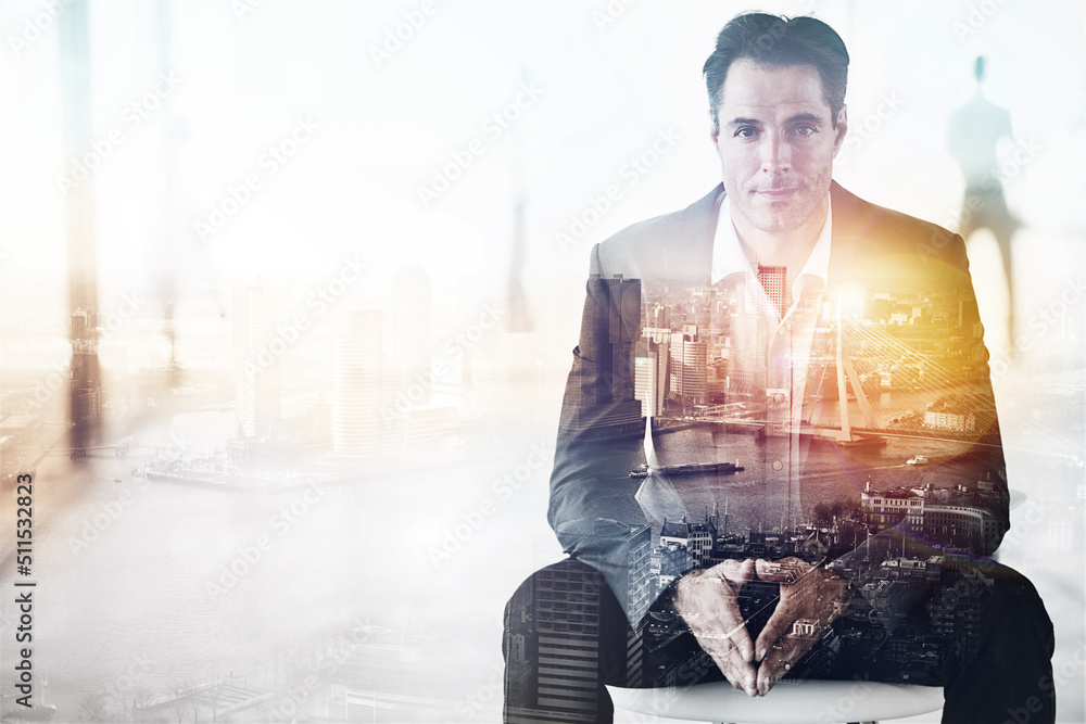 King of the concrete jungle. Portrait of a handsome businessman superimposed over a cityscape.