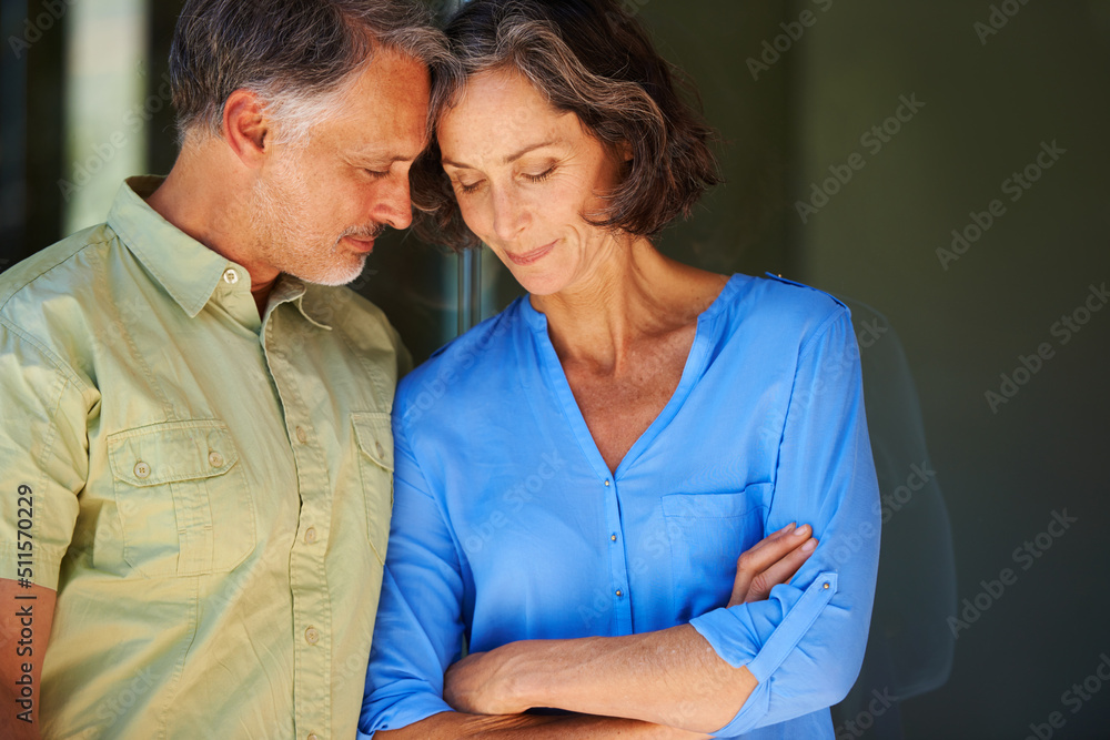 Getting close to the one I love. Shot of a mature couple leaning in toward eachother.