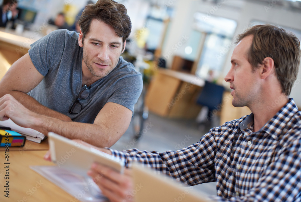 We make technology work for us. Shot of business colleagues discussing matters with the help of wire