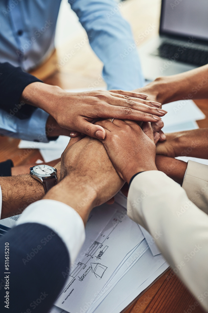 Feeling their team motivation. Closeup shot of an unrecognizable group of businesspeople joining the