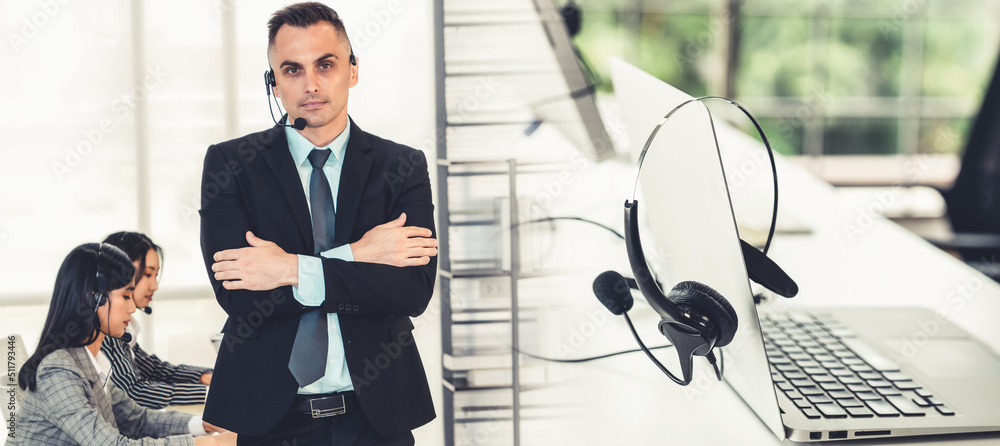 Business people wearing headset working in office to support remote customer or colleague. Call cent