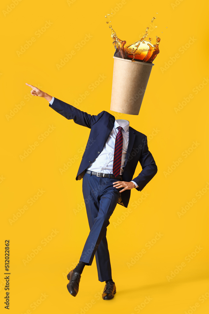 Dancing businessman with cup of hot coffee instead of his head on yellow background