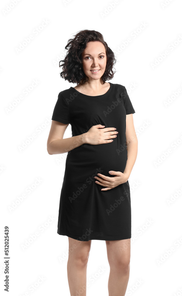 Young pregnant woman in black dress on white background