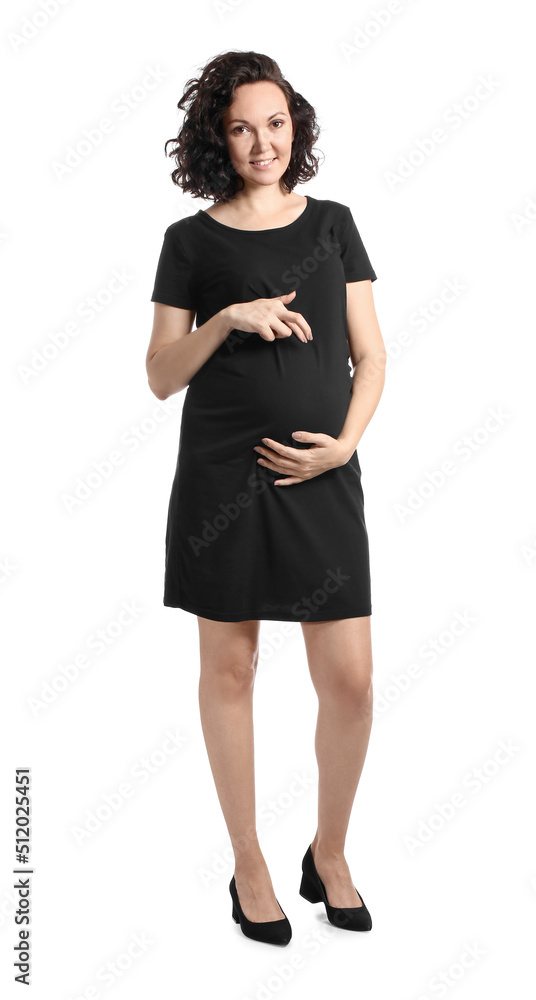 Young pregnant woman in black dress on white background