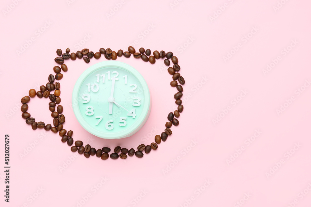 Cup made of coffee beans and alarm clock on pink background