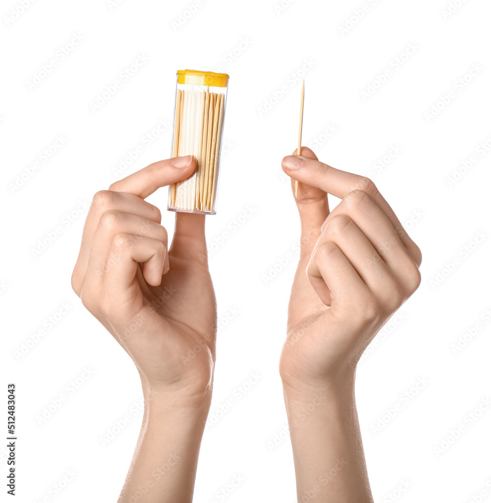 Woman holding box with bamboo toothpicks on white background