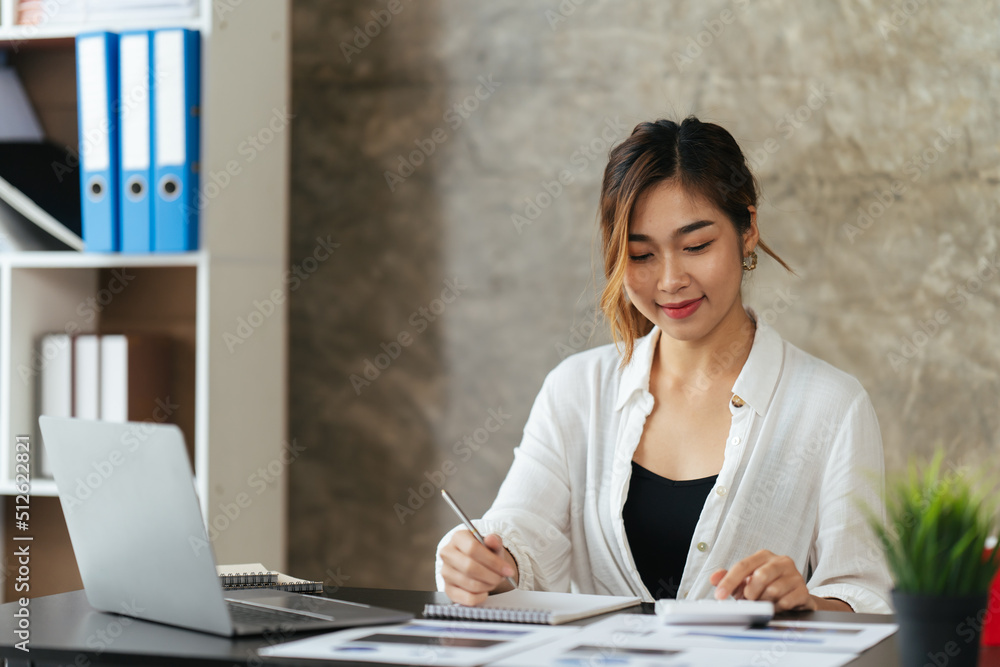 Asian beautiful woman thinking idea with laptop computer in coffee shop