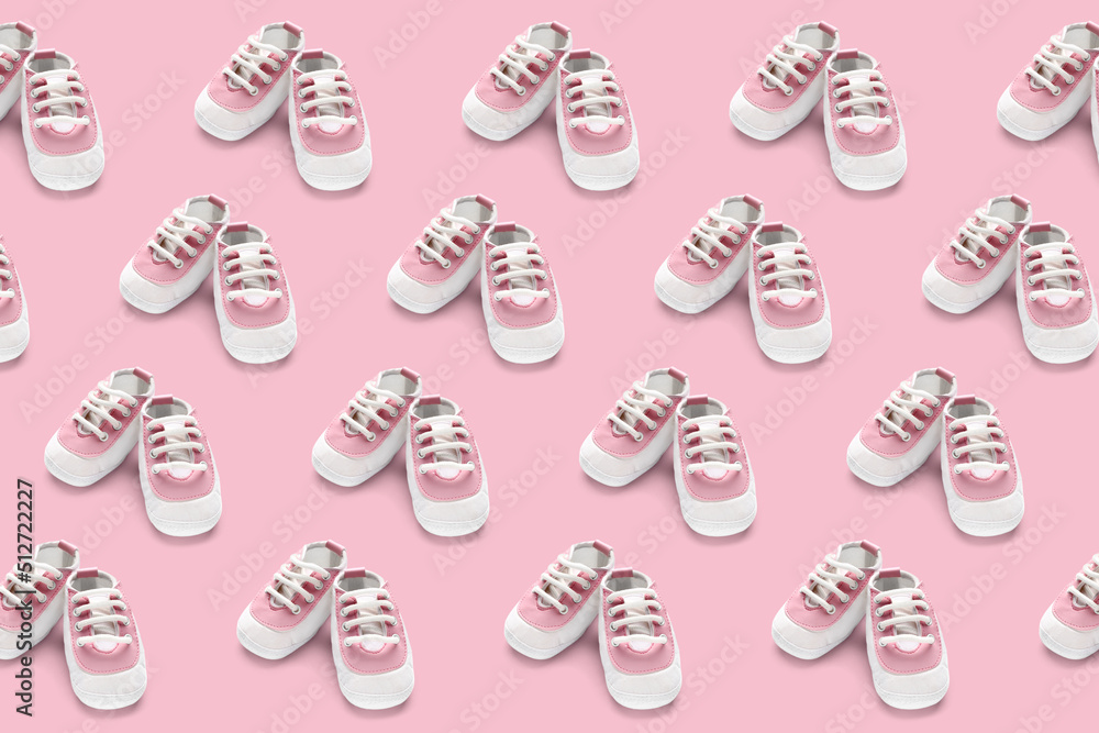 Baby booties on white background