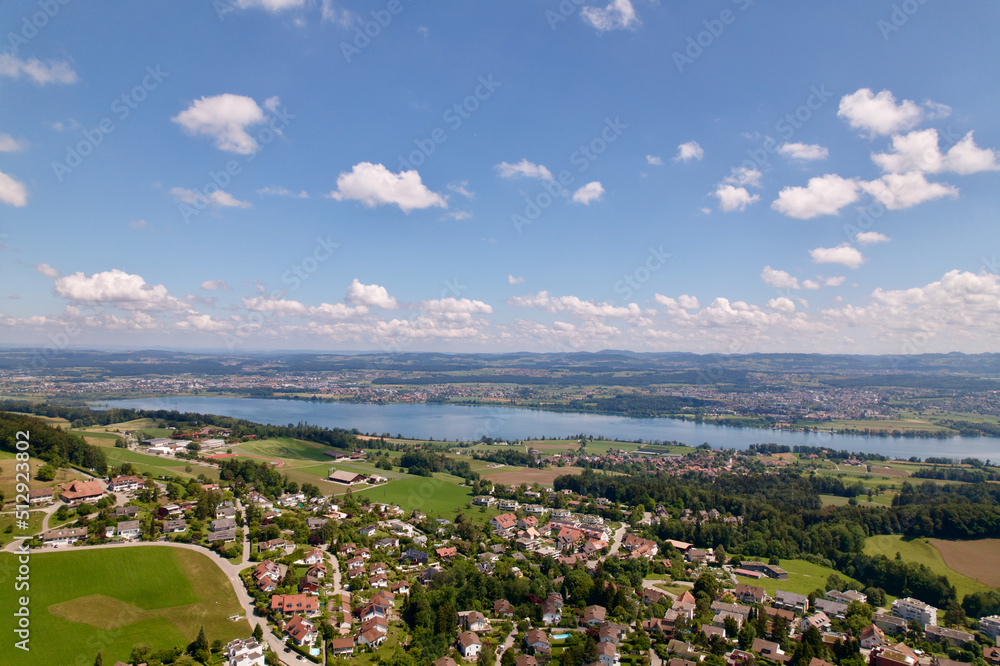 Scenic rural landscape with Lake Greifensee at Forch Küsnacht with mountain panorama in the backgrou