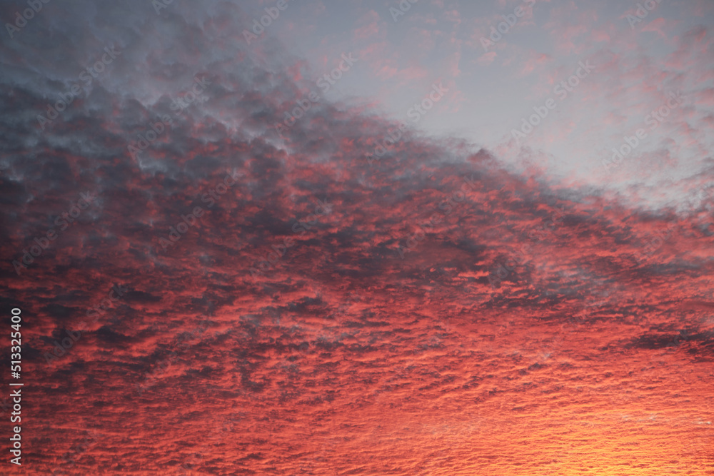 Dramatic sunset sky with amazing red clouds. Abstract nature background