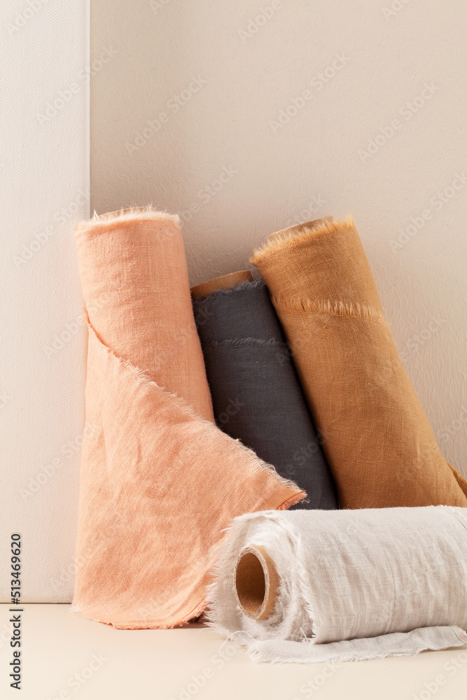 rolls of linen cloth on table.