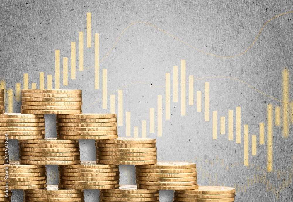 Stack of coins next to a curve symbolizing rising costs due to inflation