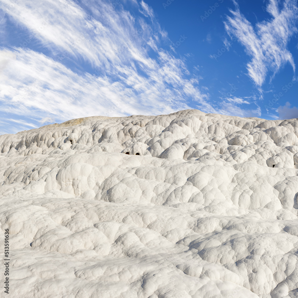 Scenic view of travertine terraces in Pamukkale Turkey. Crystallised calcium formations formed by th